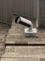 Bullet camera on a brick corner mount.