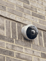Exterior dome camera on brick.