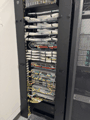 Floor rack, patch panels and switches, color-coded.